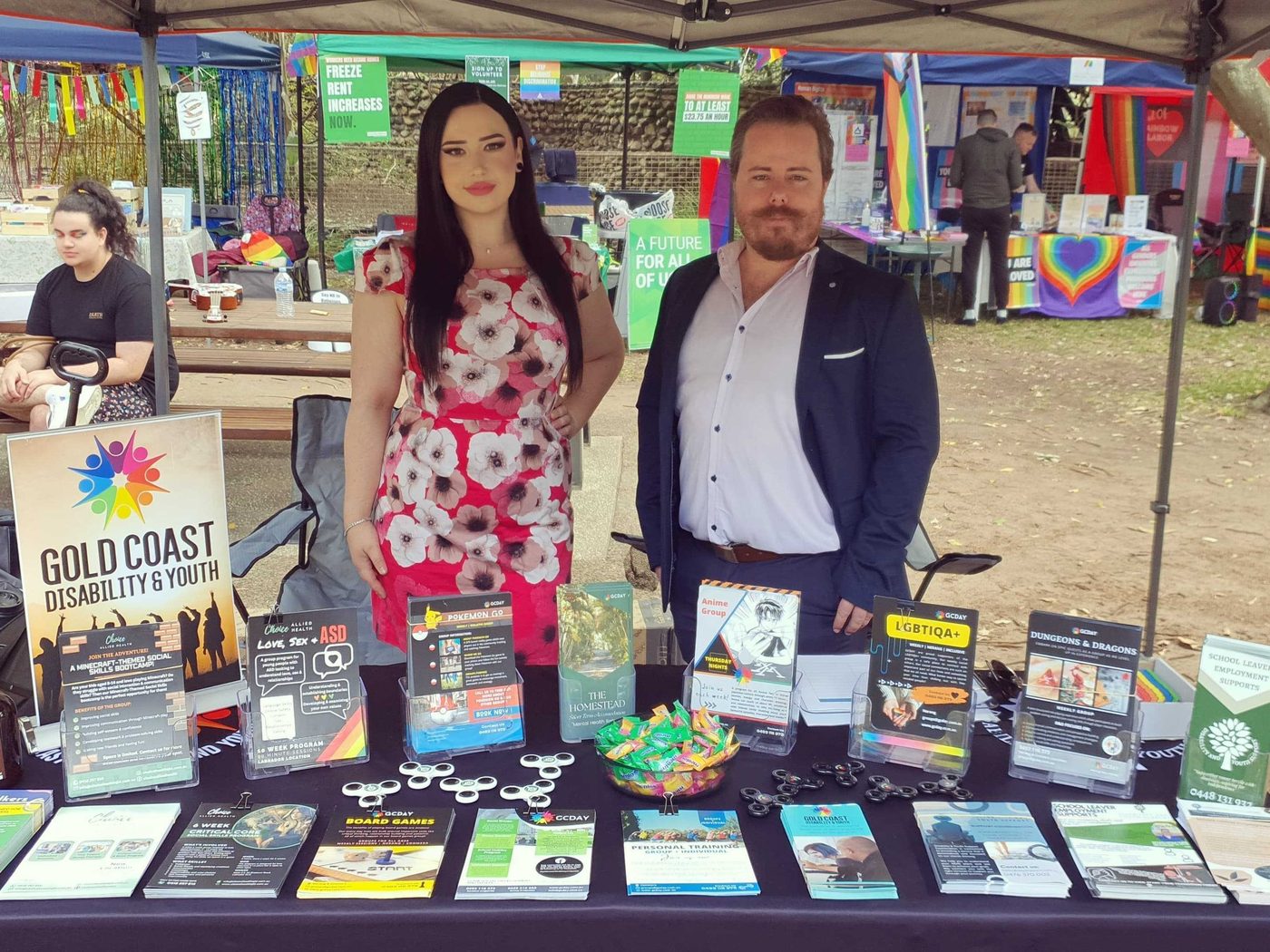 Two staff at the GCDAY stall at a community event