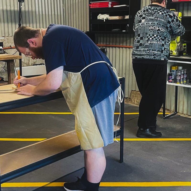Marking out timber at the workshop bench